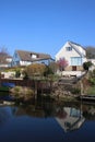 Houses and reflections in Lancaster Canal, Borwick