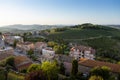 View on the houses, vineyards and hills of the historic Italian village of Cossignano Royalty Free Stock Photo