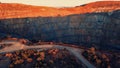 View of a huge open pit mine in rocky terrain Royalty Free Stock Photo