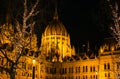 View of Hungarian Parliament building close view and Christmas bokeh lights at night Royalty Free Stock Photo