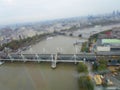 View of Hungerford Bridge over River Thames, London, England, Tilt Shift