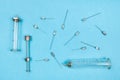 view of hypodermic needles and syringes on blue Royalty Free Stock Photo