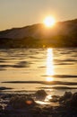 View of the ice and the rising sun over the mountains Royalty Free Stock Photo
