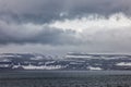 View at Iceland fjord with cold threatening sky Royalty Free Stock Photo