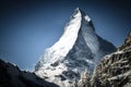 A view of the iconic Matterhorn against a clear blue sky in winter. Zermatt, Switzerland, AI generated Royalty Free Stock Photo