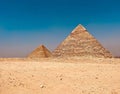 View of the iconic Pyramids of Giza in Cairo, Egypt, framed against the backdrop of desert landscape