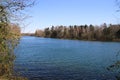 View on idyllic german lake with bare trees in spring on sunny day - BrÃÂ¼ggen, Venekotensee, Germany Royalty Free Stock Photo
