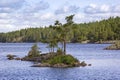 View of an idyllic lake with a small island in a Swedish forest Royalty Free Stock Photo