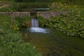 View of idyllic spring landscape with little waterfall, Umbria