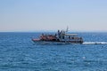 View from Ika`s seaside promenade, open sea with a touristic boat, Adriatic coast, Kvarner bay, city details, Croatia Royalty Free Stock Photo