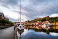 View of the illuminated houses and yachts with Fredriksted fortress at the background in Halden, Norway Royalty Free Stock Photo