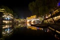 View of illuminated at night riverside houses in ancient town of Fenghuang, China Royalty Free Stock Photo