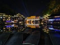 View of illuminated at night riverside houses in ancient town of Fenghuang known as Phoenix Royalty Free Stock Photo