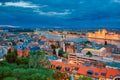 View of illuminated Parlament and riverside of Danube river in Budapest, Hungary during sunset with dramatic sky Royalty Free Stock Photo