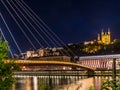 View of footbrige over Saone river and Vieux Lyon by night in Lyon, France Royalty Free Stock Photo