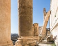 Inclined Roman column leaning against Temple of Bacchus wall, Heliopolis Roman ruins, Baalbek, Lebanon Royalty Free Stock Photo