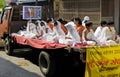 View of Indian Jain community people on horse drawn chariot in a procession