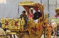 View of Indian Jain community people on horse drawn chariot in a procession