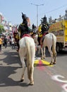View of Indian Jain community people with horse riders in a procession