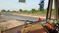 View of indian road from inside of public transport