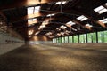 Panoramic view of an empty indoor horse riding arena Royalty Free Stock Photo