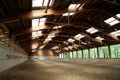 Panoramic view of an empty indoor horse riding arena Royalty Free Stock Photo