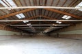 Panoramic view of an empty indoor horse riding arena Royalty Free Stock Photo