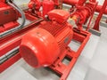 View at industrial electrically powered water pumps and pipes, this pumping group serves for water injection for building fires, Royalty Free Stock Photo