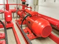 View at industrial electrically powered water pumps and pipes, this pumping group serves for water injection for building fires,