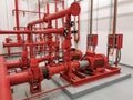 View at industrial electrically powered water pumps and pipes, this pumping group serves for water injection for building fires,