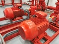 View at industrial electrically powered water pumps and pipes, this pumping group serves for water injection for building fires,