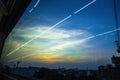 View of Industrial landscape with silhouettes of cranes on the sunset background From the windows of the electric train.Bangkok,