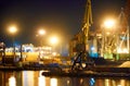 View of the industrial port at night - ships waiting for loading and unloading, cargo transportation by sea Royalty Free Stock Photo