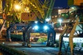 View of the industrial port at night - ships waiting for loading and unloading, cargo transportation by sea Royalty Free Stock Photo