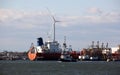 View of the industrial waterfront across Kill Van Kull strait, with a wind turbine