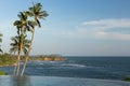 View from infinity edge pool to ocean and palms