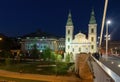 View of the Inner City Parish Church Budapest,Hungary, in the evening light from the Elisabeth Bridge. Royalty Free Stock Photo