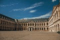 View of the inner courtyard of the Les Invalides Palace with old cannons in a sunny day at Paris. Royalty Free Stock Photo