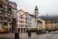 Innsbruck Austria street scene on a rainy foggy day.