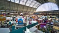 View inside a bustling convention center showcasing diverse merchandise