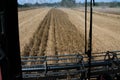 The view from inside the cab of an agricultural harvester