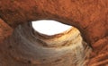 View from inside a cave looking out from below to the top Royalty Free Stock Photo