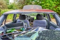 View of inside of destroyed abandoned car with broken car glasses