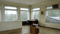 View inside of an empty old apartment with many big windows. Stock footage. Flat needs renovation. Royalty Free Stock Photo