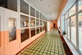 View inside the entrance  corridor , old school or apartment building, dead end long and narrow walkway and glass window with Royalty Free Stock Photo