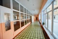 View inside the entrance  corridor , old school or apartment building, dead end long and narrow walkway and glass window with Royalty Free Stock Photo
