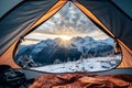 View from inside mountaineer tent of sunrise over snowy mountain peak on summit in winter. AI Generative