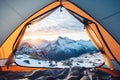 View from inside mountaineer tent of sunrise over snowy mountain peak on summit in winter. AI Generative