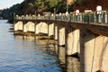 SUNLIGHT ON CONCRETE SLUICE GATES OF A DAM