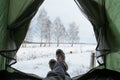 View from the inside of the tent, broken into the winter. Royalty Free Stock Photo